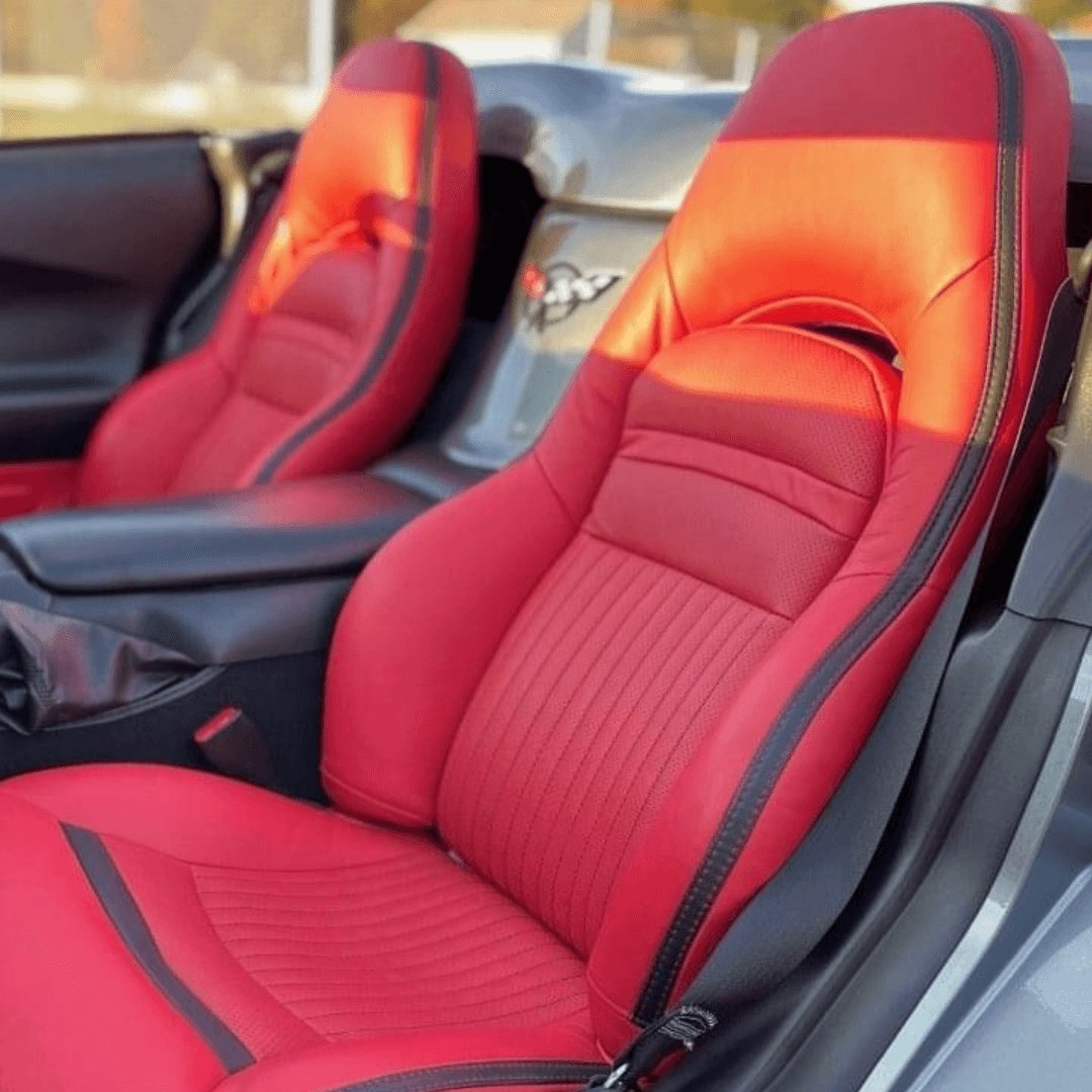 Corvette C5 interior featuring red and black leather car seat covers. The vibrant red leather with black accents enhances the sporty look of the car's interior, providing a stylish and comfortable seating experience.