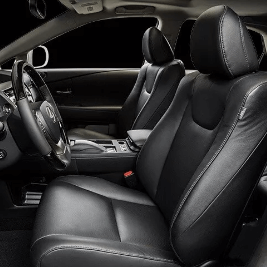 Interior of a Lexus RX450h showcasing sleek black leather seat covers with precise stitching, custom-fit for 2010-2015 models.