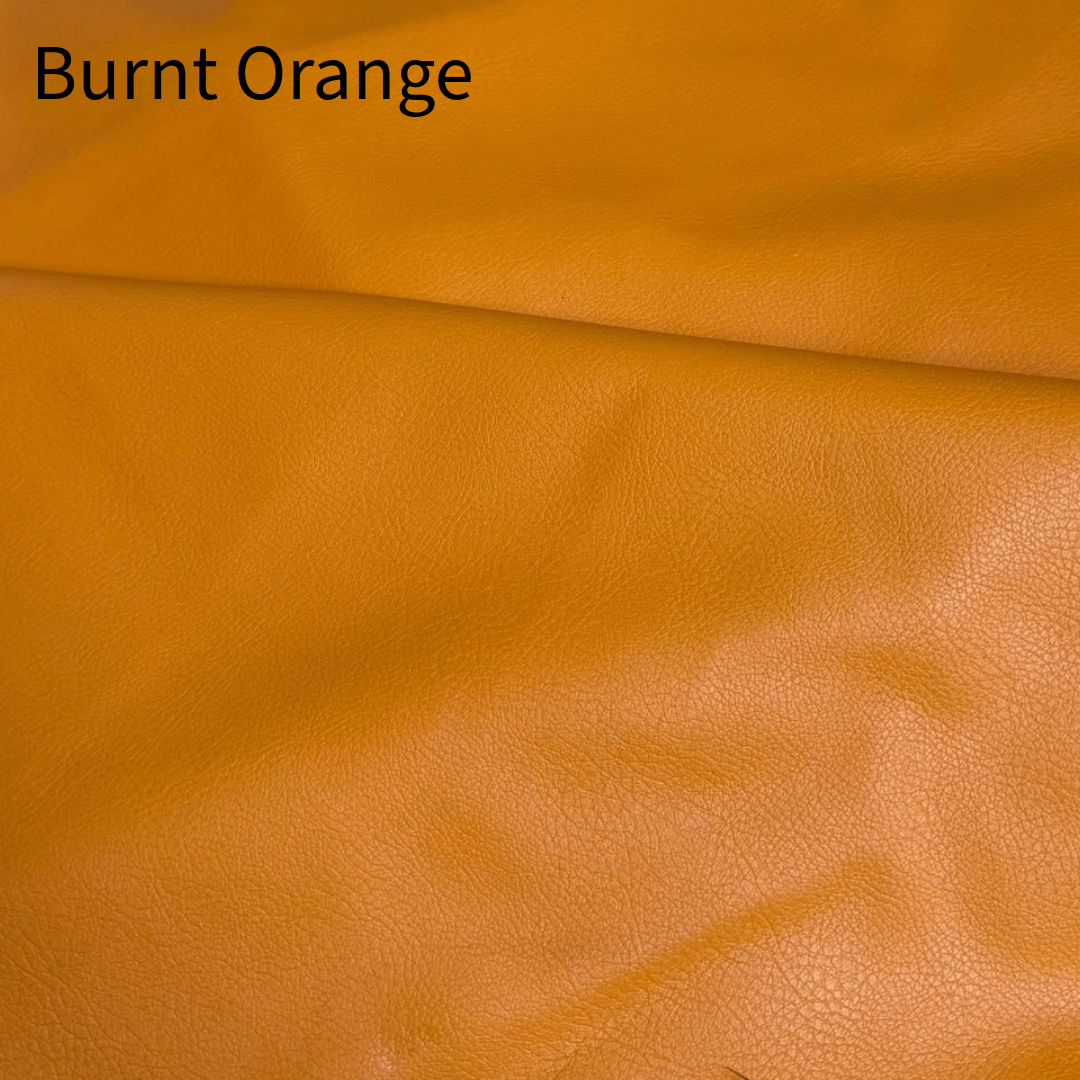 Close-up view of a burnt orange leather material, highlighting its textured surface and rich, warm hue, labeled with the color name 'Burnt Orange' at the top.