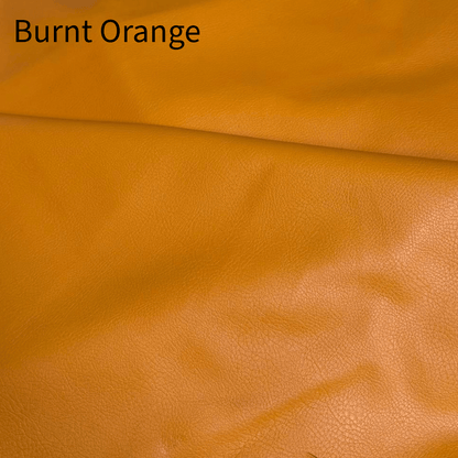 Close-up view of a burnt orange leather material, highlighting its textured surface and rich, warm hue, labeled with the color name 'Burnt Orange' at the top.