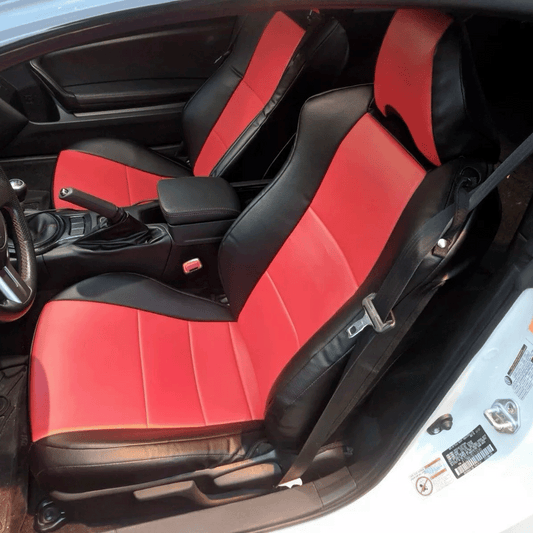 Bright red and black leather seat cover replacements for Toyota GT 86, Subaru BRZ, and Scion FR-S, designed to rival products from Ridies, Lseat.com, and Katzkin. The striking red leather combined with black accents boosts the sporty interior presence of these models, providing a luxurious and visually appealing upgrade.