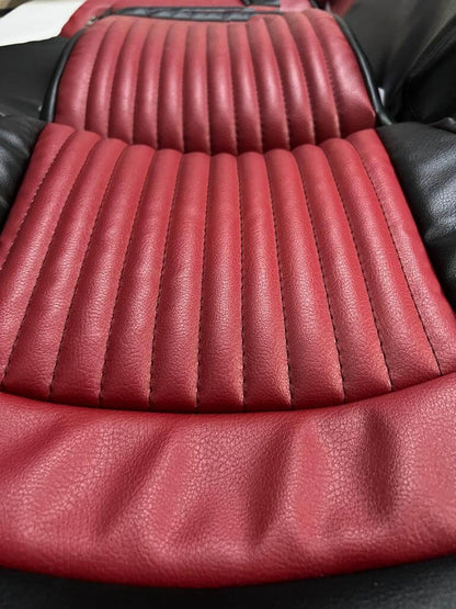 Set of custom black and burgundy faux leather car seat covers designed for Corvette C5. Features a burgundy pleated center, black side accents, and a black horizontal stripe. Includes individual and paired seat covers, with close-up views highlighting detailed stitching and high-quality materials, offering a stylish and durable upgrade to the car's interior.