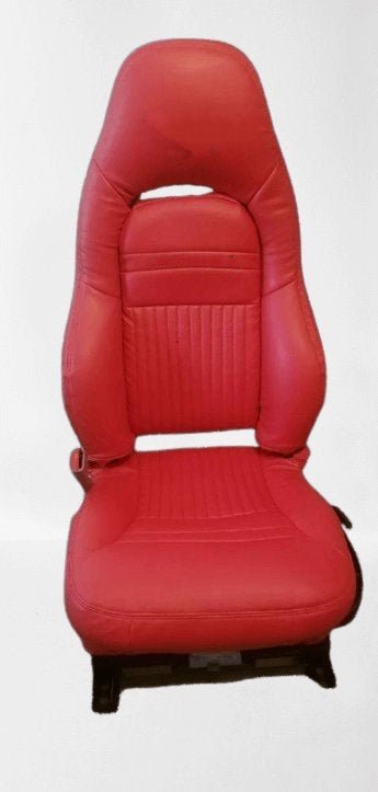 Set of custom red faux leather car seat covers designed for Corvette C5. Features a pleated center and sleek design. Includes individual and paired seat covers, highlighting detailed stitching and high-quality materials for a stylish and durable interior upgrade.