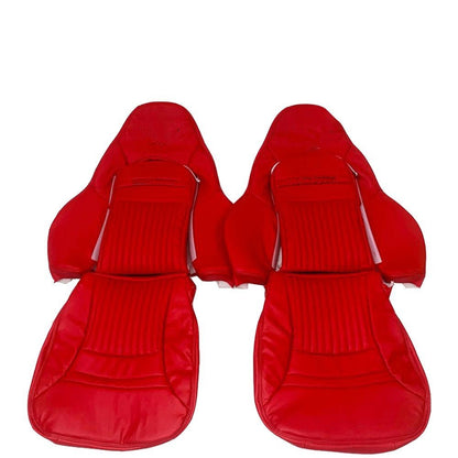 Set of custom red faux leather car seat covers designed for Corvette C5. Features a pleated center and sleek design. Includes individual and paired seat covers, highlighting detailed stitching and high-quality materials for a stylish and durable interior upgrade.