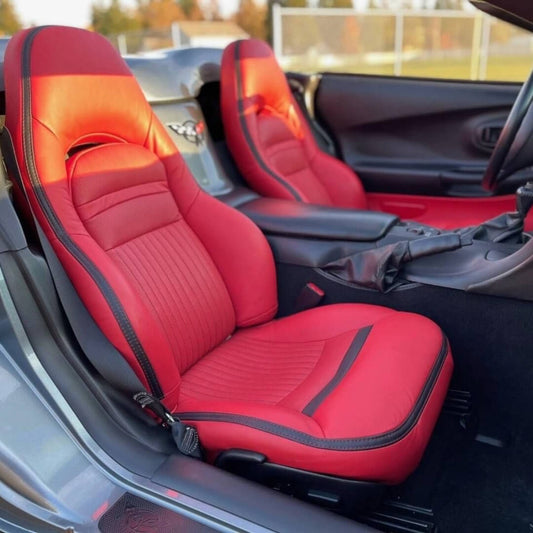 Corvette C5 interior featuring red and black leather car seat covers. The vibrant red leather with black accents enhances the sporty look of the car's interior, providing a stylish and comfortable seating experience.