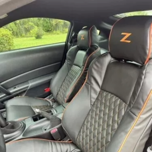 Premium black leather seat covers for Nissan 350Z, showcasing orange piping accents and a diamond-stitched design, tailored for 2003-2008 models.