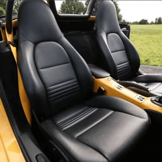 Side view of Porsche Boxster 986 (1997-2004) seats with premium black leather seat covers, showcasing luxury and a perfect fit.