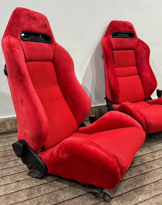 Front view of Recaro SR3 Confetti DC2 Type R bucket seat in red suede, showcasing the sleek design and comfortable cushioning.